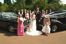 Wedding party with car