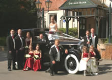 Wedding party with car