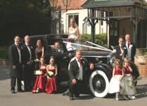 Wedding party with car