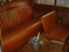 Inside view of rear seats showing extra seat