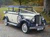 Front corner view of car with wedding ribbons