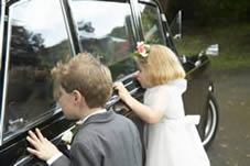 Young children looking into car