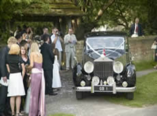 Wedding with guests and car