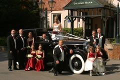 Wedding party with car