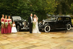 Wedding group with cars