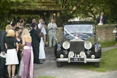 Wedding with guests and car
